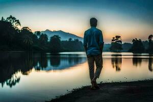 une homme permanent par le l'eau à le coucher du soleil. généré par ai photo