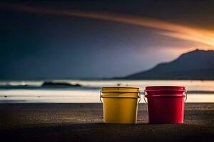 deux rouge et Jaune seaux sur le plage à le coucher du soleil. généré par ai photo