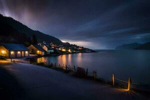 une village sur le rive de une Lac à nuit. généré par ai photo