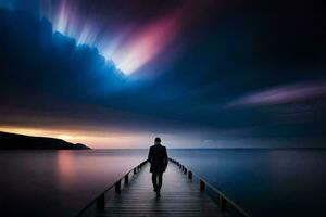 une homme des promenades le long de une jetée à nuit avec une coloré ciel. généré par ai photo