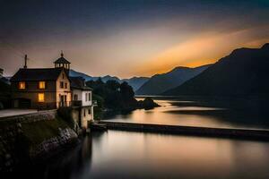 une maison est assis sur le bord de une Lac à le coucher du soleil. généré par ai photo