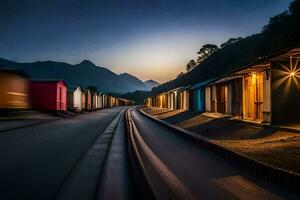 une longue exposition photographier de une train qui passe par une rangée de coloré huttes. généré par ai photo