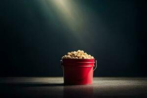 une rouge seau rempli avec pop corn sur une foncé tableau. généré par ai photo