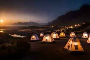 une groupe de tentes ensemble en haut dans le montagnes à nuit. généré par ai photo