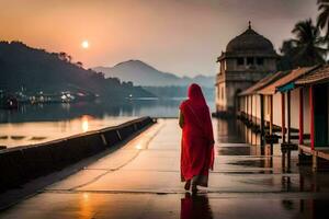 une femme dans une rouge robe en marchant le long de une chemin près l'eau. généré par ai photo