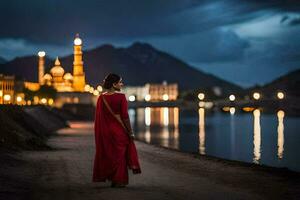 une femme dans une rouge sari des promenades le long de le rive à nuit. généré par ai photo