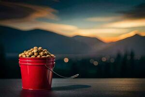 une rouge seau rempli avec cacahuètes sur une table dans de face de une Montagne. généré par ai photo