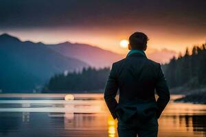 une homme permanent dans de face de une Lac à le coucher du soleil. généré par ai photo