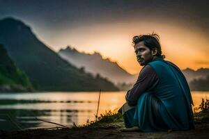 une homme séance par le l'eau à le coucher du soleil. généré par ai photo