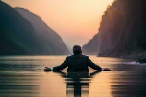 une homme dans une costume séance dans le l'eau à le coucher du soleil. généré par ai photo