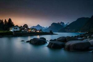 une maison est assis sur le rive de une Lac à crépuscule. généré par ai photo