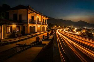 une longue exposition photo de une route à nuit. généré par ai