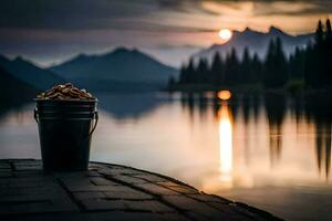 une seau de des noisettes est assis sur une Dock à le coucher du soleil. généré par ai photo