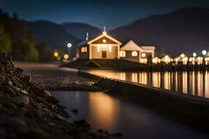 une petit maison est assis sur le rive de une Lac à nuit. généré par ai photo