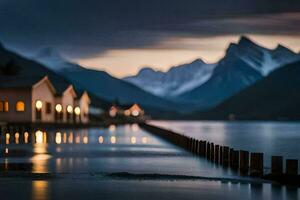 une Lac et Maisons dans le montagnes à nuit. généré par ai photo