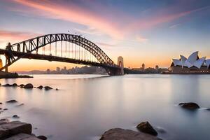 le Sydney port pont et opéra maison à le coucher du soleil. généré par ai photo