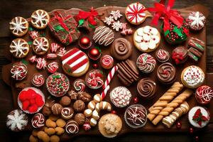 une grand assortiment de Noël biscuits et des sucreries. généré par ai photo