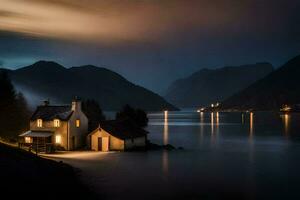 une maison est assis sur le rive de une Lac à nuit. généré par ai photo