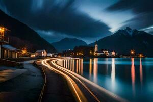 une longue exposition photographier de une Lac et Montagne à nuit. généré par ai photo