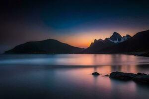 le montagnes et mer à le coucher du soleil. généré par ai photo