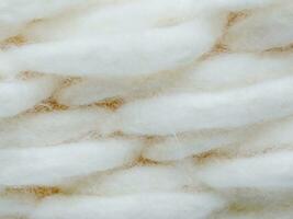 texture de une blanc duveteux la laine Contexte. photo