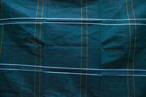 foncé turquoise vert Bande coton lungi en tissu avec Bande modèle abstrait texture Contexte fond d'écran photo