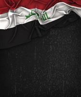 drapeau de l'irak vintage sur un tableau noir grunge avec un espace réservé au texte photo