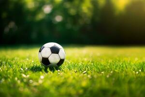 ai généré une football Balle sur le herbe avec le Soleil derrière il photo