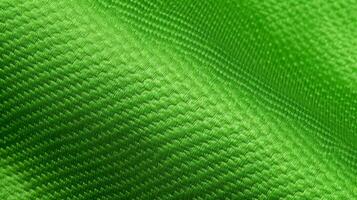 vert football en tissu texture avec air engrener. athlétique porter toile de fond photo