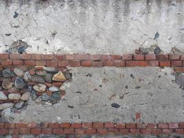 vieux fond de mur de brique et de pierre photo