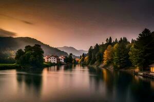 une Lac et Maisons dans le montagnes à le coucher du soleil. généré par ai photo