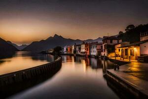 une Lac à le coucher du soleil avec Maisons sur le rive. généré par ai photo