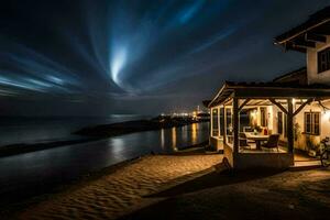 une maison sur le plage à nuit avec une lumière Piste dans le ciel. généré par ai photo