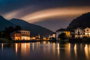 une ville à nuit avec une rivière et montagnes dans le Contexte. généré par ai photo