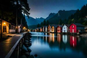 coloré Maisons ligne le rive de une Lac à nuit. généré par ai photo