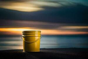 une Jaune seau est assis sur le plage à le coucher du soleil. généré par ai photo