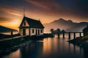 une petit maison est assis sur le rive de une Lac à le coucher du soleil. généré par ai photo