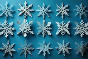 magnifique DIY papier flocons de neige dans milieu création isolé sur une bleu pente Contexte photo