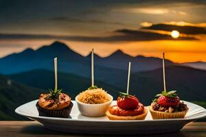 quatre mini petits gâteaux sur une assiette avec une Montagne dans le Contexte. généré par ai photo