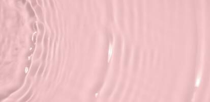 abstrait transparent l'eau ombre surface texture Naturel ondulation sur rose Contexte photo
