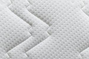 Gros plan du fond de texture matelas blanc photo