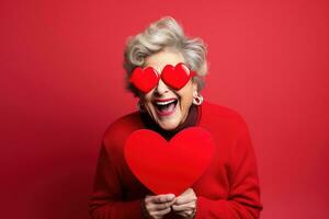 portrait de une content femme avec rouge cœur sur une rouge background.valentine's journée concept ai généré photo