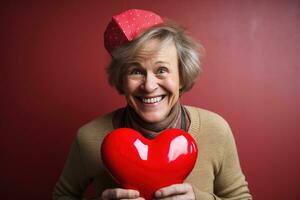 portrait de une content femme avec rouge cœur sur une rouge background.valentine's journée concept ai généré photo