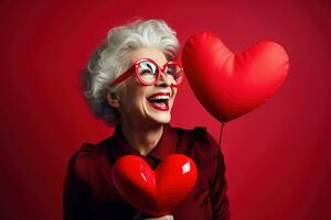 portrait de une content femme avec rouge cœur sur une rouge background.valentine's journée concept ai généré photo