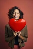 portrait de une content femme avec rouge cœur sur une rouge background.valentine's journée concept ai généré photo