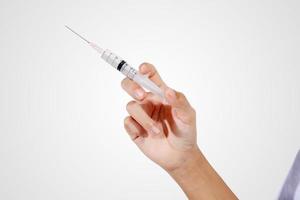 docteur tenant une seringue d'injection médicale photo