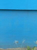 proche en haut bleu peint ciment mur Contexte photo