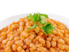 bouilli des haricots avec tomate et épices dans une bol photo