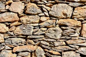 une mur fabriqué de rochers et des pierres photo