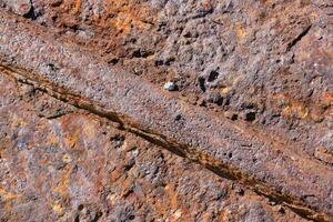 une proche en haut de une rouillé métal mur photo